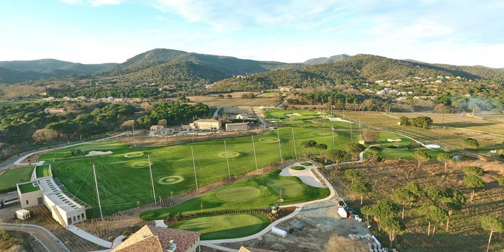 Kennewick Aerial view of a synthetic grass golf course surrounded by hills