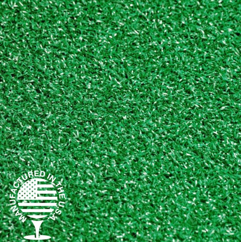 A close up shot of artificial turf that is bright green with a made in the usa logo